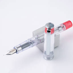 Pilot Prera Clear Fountain Pen - Red, Calligraphy Nib, on stand (image may depict a different style nib)