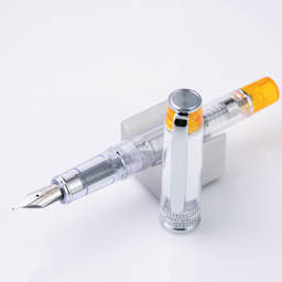 Pilot Prera Clear Fountain Pen - Orange, Medium Nib, on stand (image may depict a different style nib)