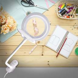 OttLite Lighted Magnifier Clip Lamp - shown with a sewing project