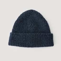 Rico Design Soft Alpaca Yarn - Navy Blue, 137 yds showing completed hat project