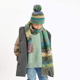 Rico Design Soft Alpaca Yarn - Aqua, 137 yds showing completed sweater project being worn