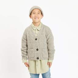 Rico Design Soft Alpaca Yarn - Beige, 137 yds showing completed cardigan project being worn