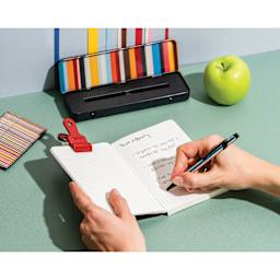 Caran d'Ache Special Edition No. 5 Paul Smith 849 Ballpoint Pen - Black, writing in notebook