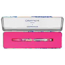 Caran d'Ache 849 Germanier Ballpoint Pen - Limited Edition, Neon Pink, inside of the metallic tin case