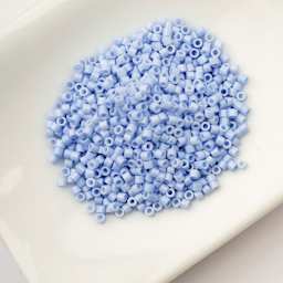 John Bead Cylin 11/0 Cylindrical Seed Beads - Bluebell Mist Opaque sitting in dish