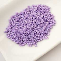 John Bead Cylin 11/0 Cylindrical Seed Beads - Light Purple Opaque sitting in dish