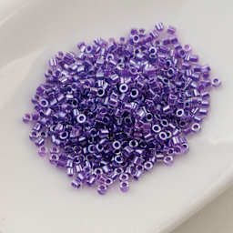 John Bead Cylin 11/0 Cylindrical Seed Beads - Lavender Gemdust sitting in dish