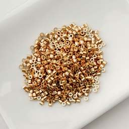John Bead Cylin 11/0 Cylindrical Seed Beads - Toasted Caramel Opaque sitting in dish
