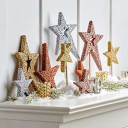 FloraCraft Diamond Dust Crushed Glass Glitter applied to star decorations