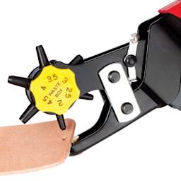 John Bead Metal Complex Deluxe Leather Hole Punch close up of hole being punched in leather