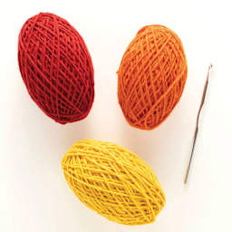 Friendly Loom Discover Crochet Scarf Kit - Sunset showing included crochet hook and yarn