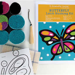 Friendly Loom Discover Latch Hooking Kit - Butterfly contents laying on table