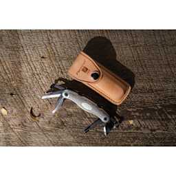 Flexcut Carvin' Jack 2.0 Folding Knife - Right-Handed - on workbench with leather sheath