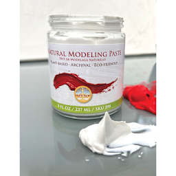 Natural Earth Paint Natural Acrylik Modeling Paste jar open with modeling paste holding a peak