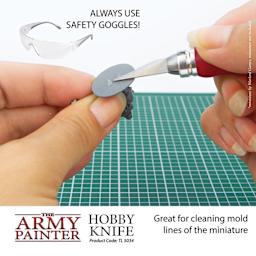 The Army Painter Precision Hobby Knife. Great for cleaning mold lines off the miniature. Always use safetly goggles. product code tl5034