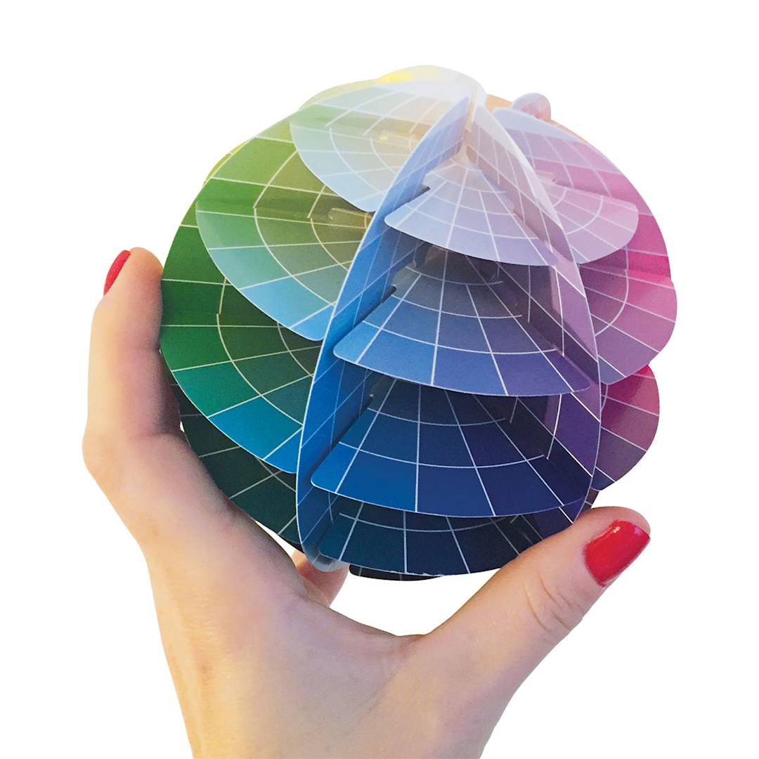 Open in modal - Kolormondo 3-D Color Wheel - Artist holding completed Color Wheel Globe