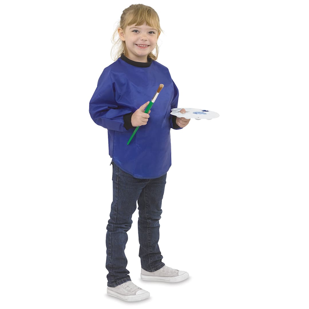Open in modal - Kids’ Waterproof Smock - Child wearing smock and holding brush and palette