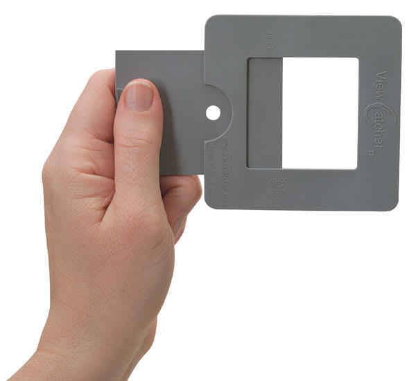 Open in modal - ViewCatcher - Hand holding Viewcatcher open, with site opening also visible