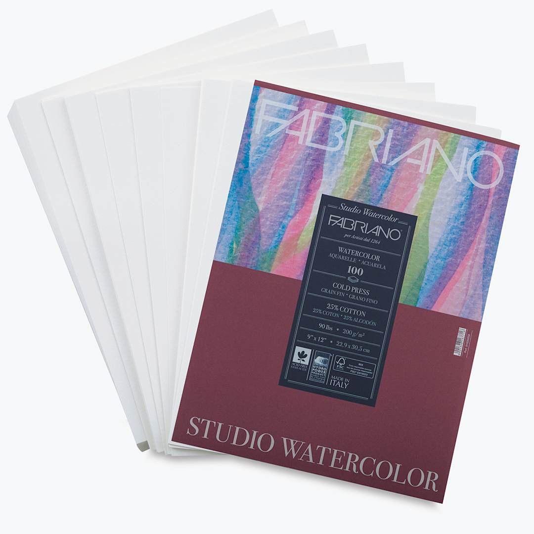 Open in modal - Fabriano Studio Watercolor Paper - Top view of package with loose sheets beneath