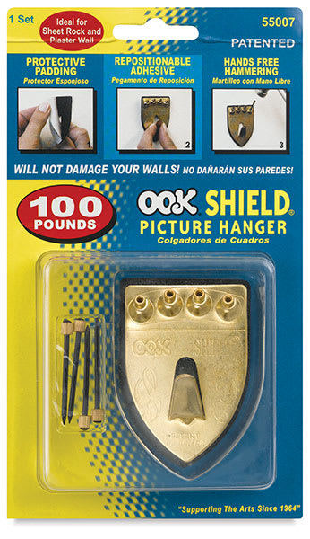 Open in modal - Ook Repositioning Shield Hangers - Front of blister package of Largest Shield
