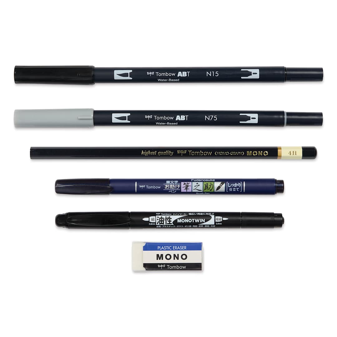 Open in modal - Tombow Lettering Basics Set, pens and markers with caps on, laid outside of the packaging