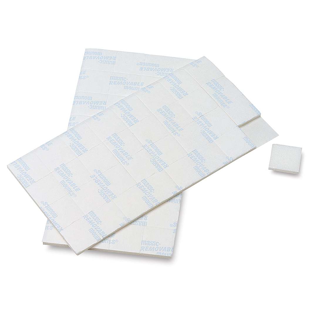 Open in modal - Removable Mounting Tabs - 2 sheets of 1/2 " tabs shown with 1 tab removed