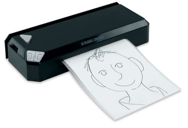 Open in modal - Black & Decker Flash Pro Thermal Laminator - Angled view laminating a drawing
