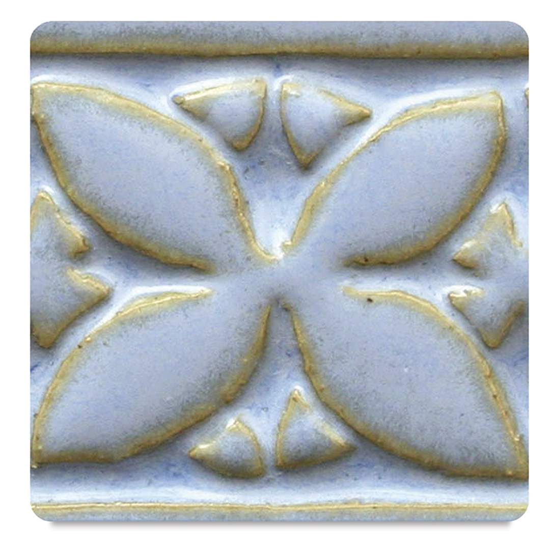 Open in modal - Amaco Potter's Choice Glazes -Arctic Blue, PC-21. Color sample in blue with golden outlines.
