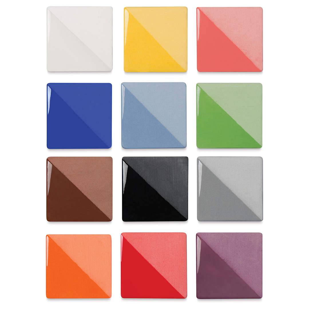 Open in modal - Speedball Ceramic Underglaze - Set of 12, 16 oz, fired on white clay bisque tiles, half covered in Speedball Clear Glaze, fired to cone 05