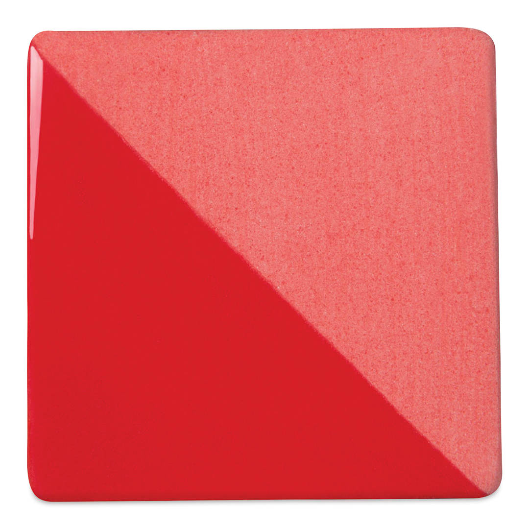 Open in modal - Speedball Ceramic Underglaze - Red, Opaque, fired on white clay bisque tiles, half covered in Speedball Clear Glaze, fired to cone 05