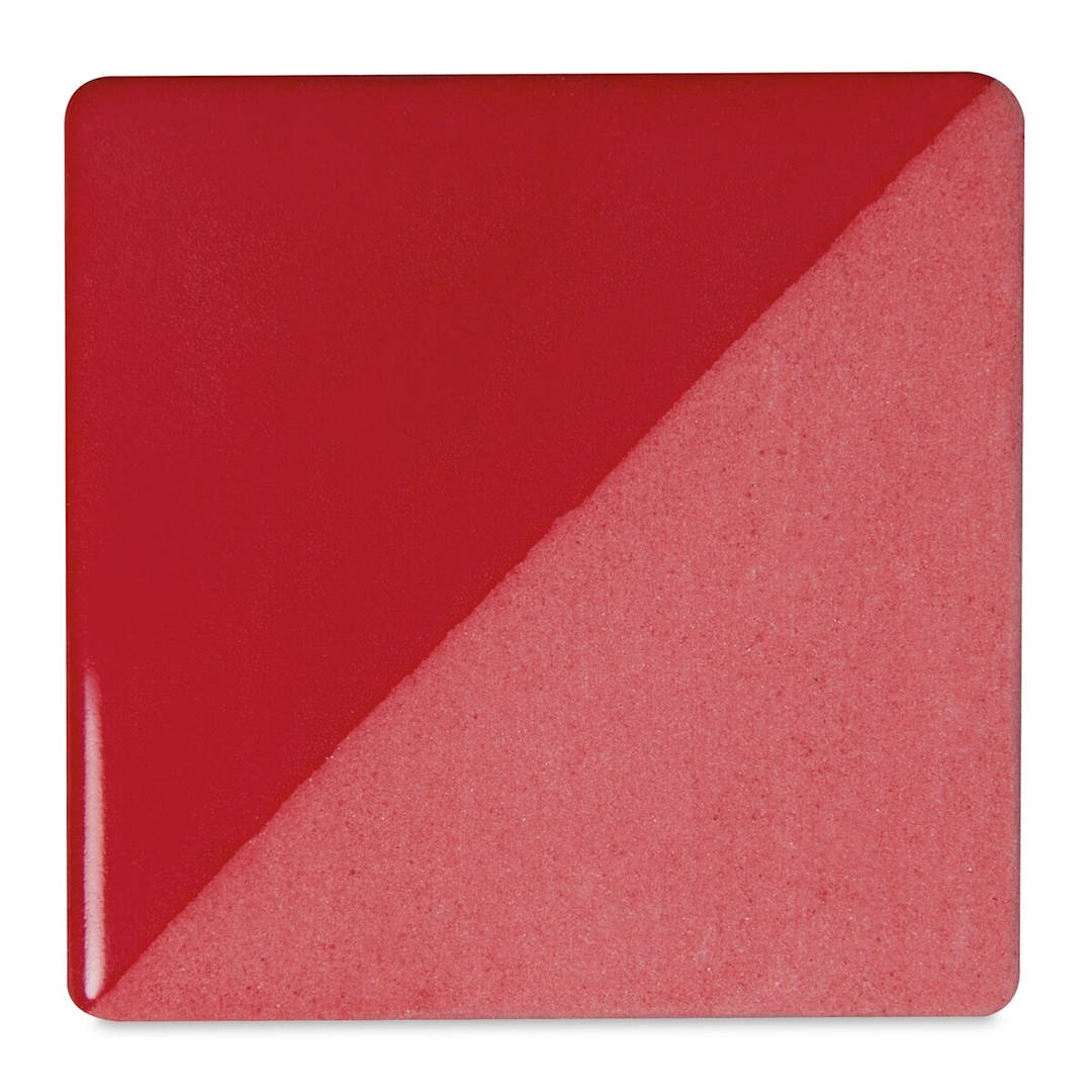 Open in modal - Speedball Ceramic Underglaze - Carmine, Opaque, fired on white clay bisque tiles, half covered in Speedball Clear Glaze, fired to cone 05