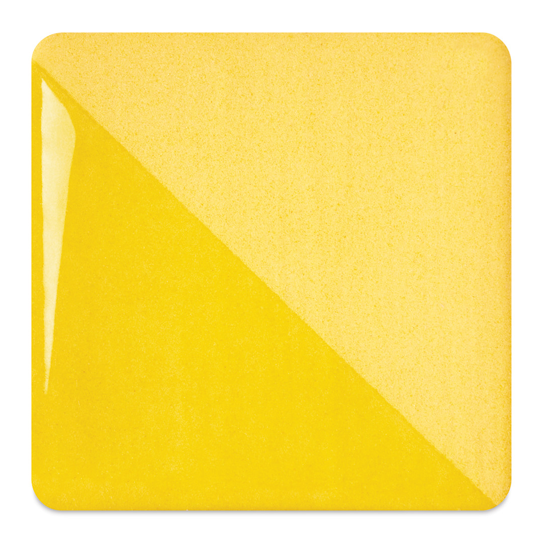 Open in modal - Speedball Ceramic Underglaze - Sunflower, fired on white clay bisque tiles, half covered in Speedball Clear Glaze, fired to cone 05