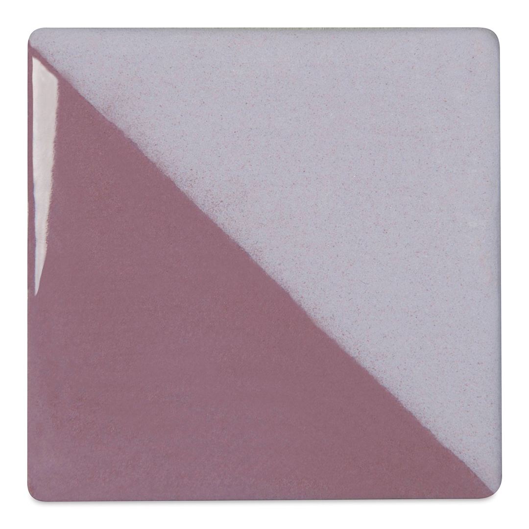 Open in modal - Speedball Ceramic Underglaze - Violet, Opaque, fired on white clay bisque tiles, half covered in Speedball Clear Glaze, fired to cone 05