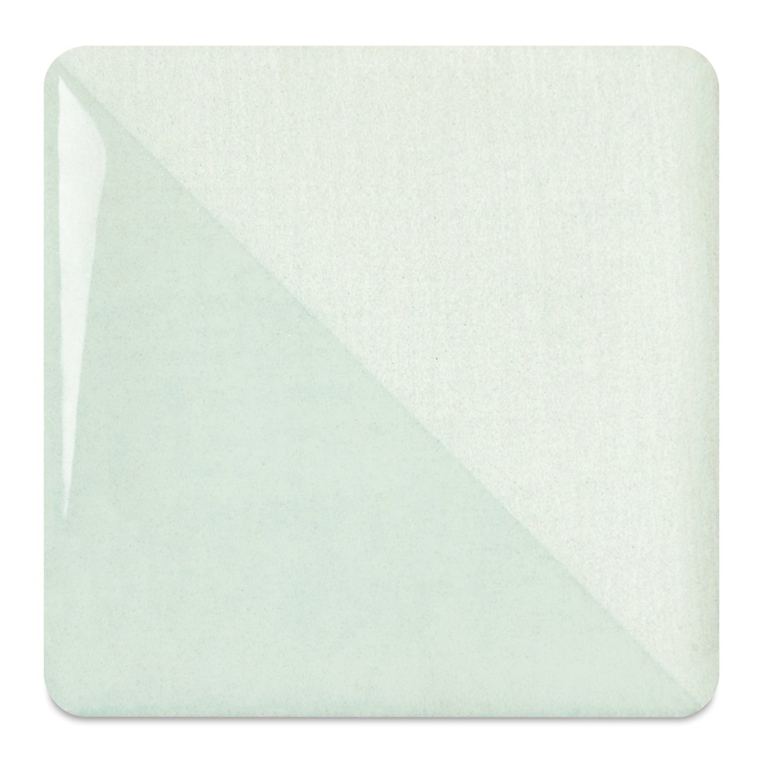 Open in modal - Speedball Ceramic Underglaze - Honeydew, fired on white clay bisque tiles, half covered in Speedball Clear Glaze, fired to cone 05