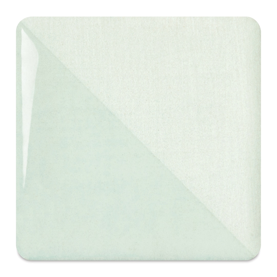 Open in modal - Speedball Ceramic Underglaze - Honeydew, fired on white clay bisque tiles, half covered in Speedball Clear Glaze, fired to cone 05