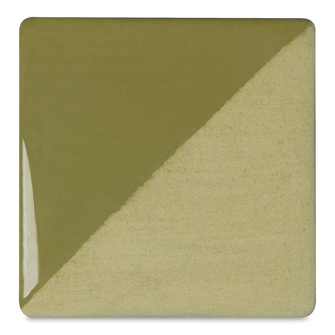 Open in modal - Speedball Ceramic Underglaze - Avocado, Opaque, fired on white clay bisque tiles, half covered in Speedball Clear Glaze, fired to cone 05