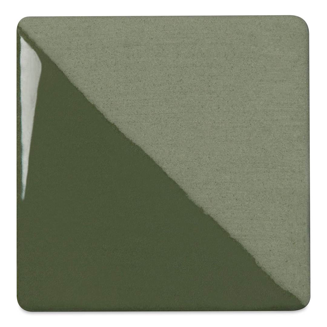 Open in modal - Speedball Ceramic Underglaze - Pine, Opaque, fired on white clay bisque tiles, half covered in Speedball Clear Glaze, fired to cone 05