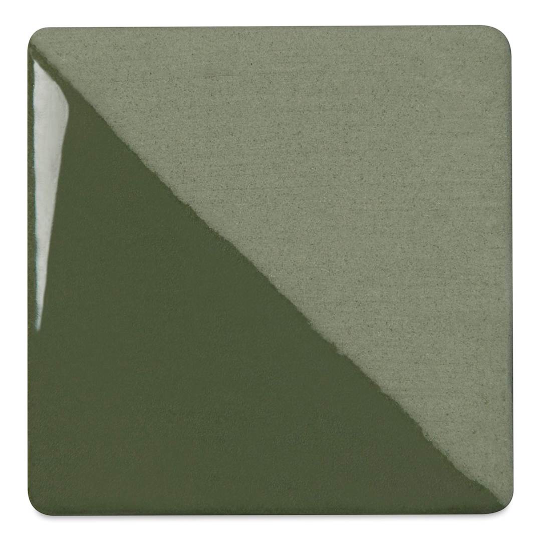 Open in modal - Speedball Ceramic Underglaze - Pine, Opaque, fired on white clay bisque tiles, half covered in Speedball Clear Glaze, fired to cone 05