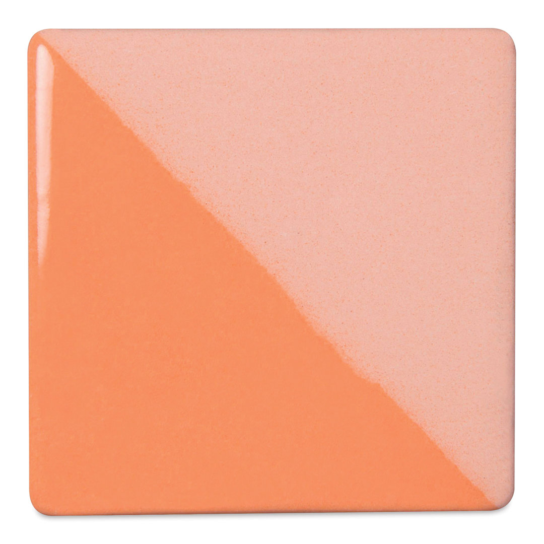 Open in modal - Speedball Ceramic Underglaze - Yellow Orange, Opaque, fired on white clay bisque tiles, half covered in Speedball Clear Glaze, fired to cone 05