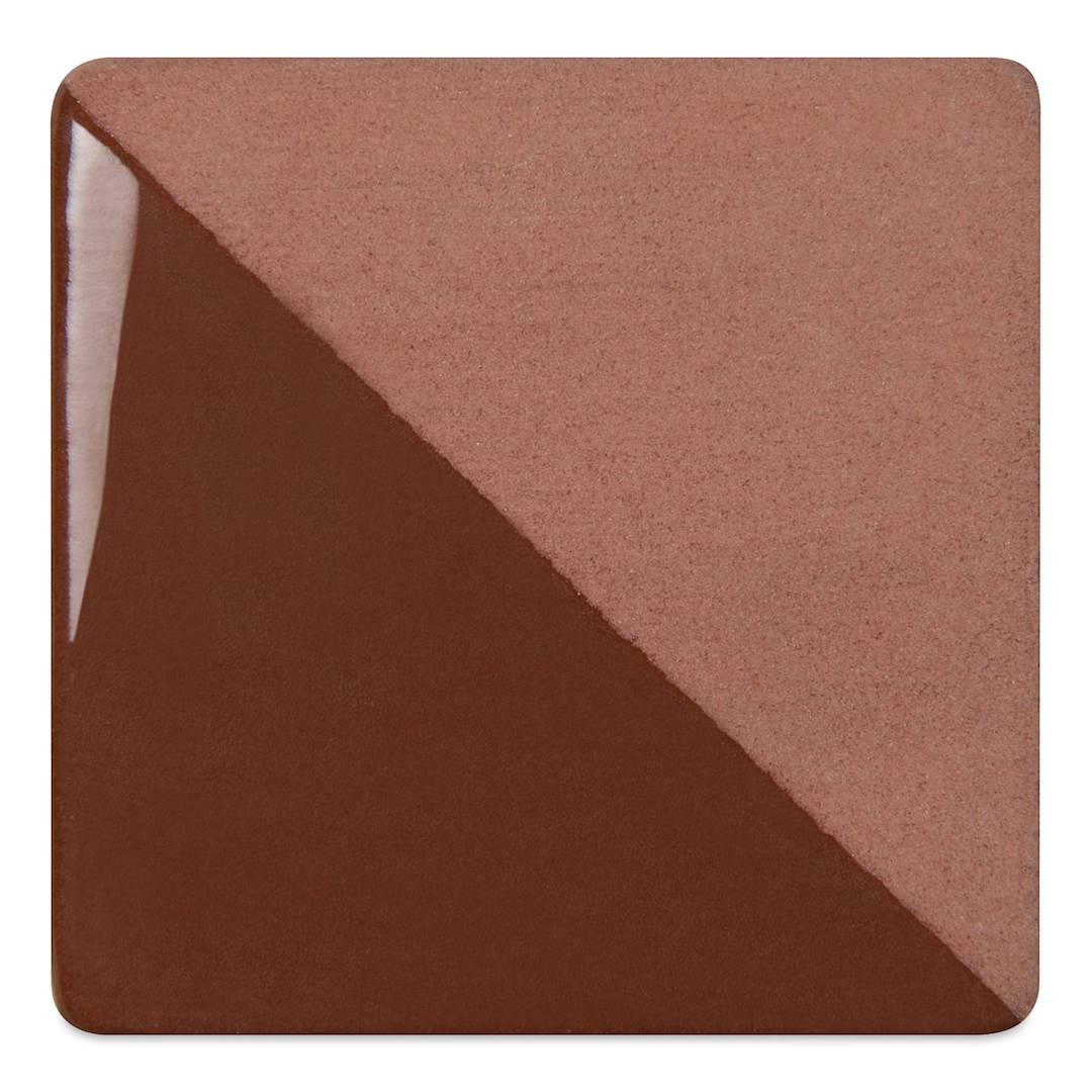 Open in modal - Speedball Ceramic Underglaze - Brown, Opaque, fired on white clay bisque tiles, half covered in Speedball Clear Glaze, fired to cone 05