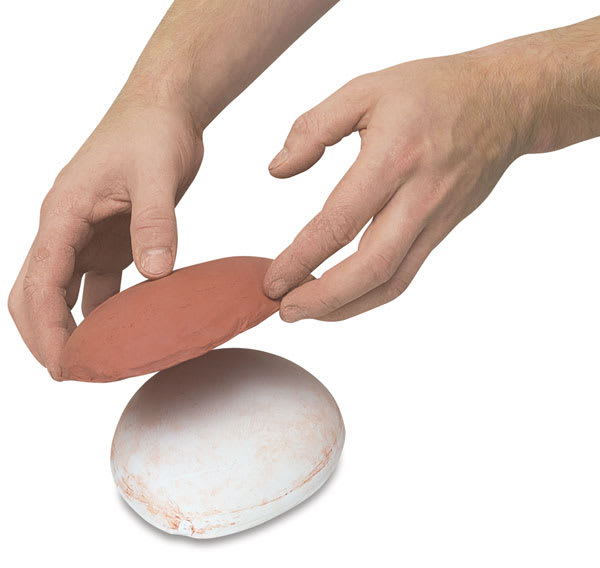 Open in modal - Amaco Drape Molds - Hands removing clay from a round mold