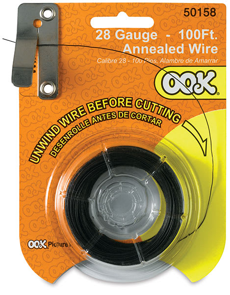 Open in modal - Ook Dark Annealed Specialty Wire - Front of 28-gauge wire package with wire fed into wire cutter