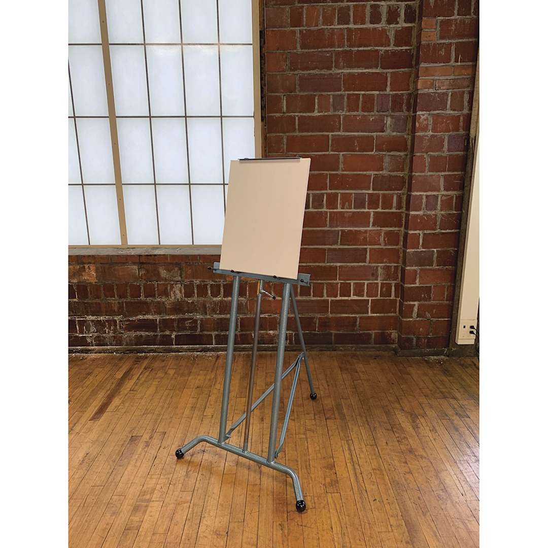 Open in modal - Klopfenstein PE 101 Steel Art Easel - Angled view of Easel shown in studio and holding canvas