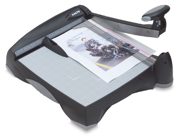 Open in modal - Laser Trimmer - Left angled view with handle raised over paper