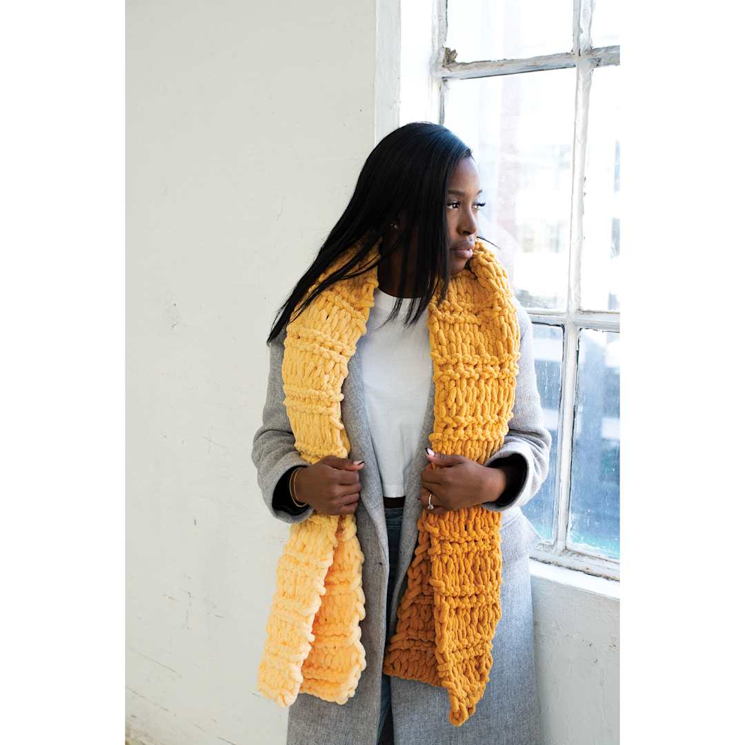 Open in modal - Lion Brand Off the Hook Ombré Yarn (woman wearing yellow knitted scarf)