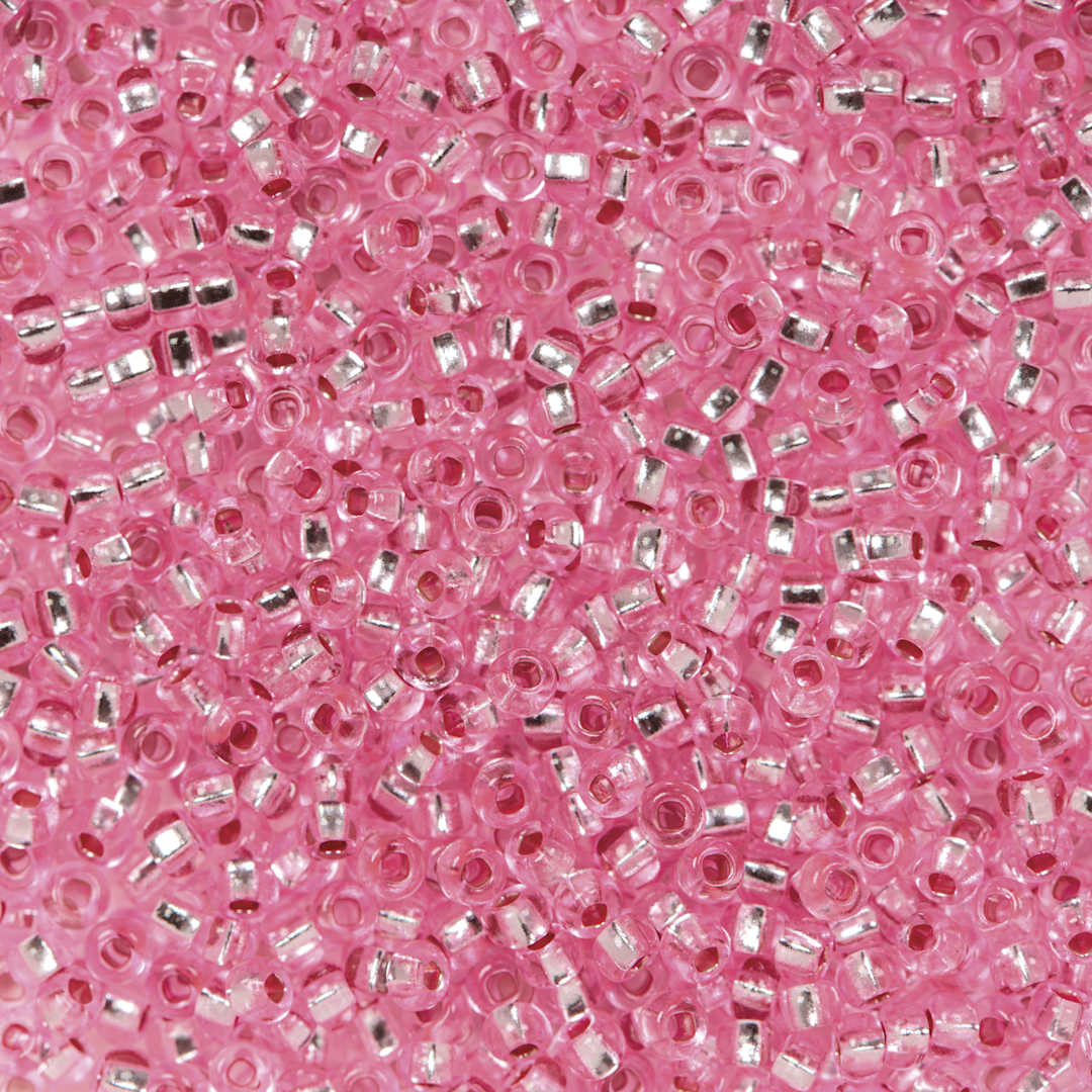 Open in modal - John Bead Czech Glass Seed Beads - Transparent Pink, Silver Lined, 10/0 - close-up