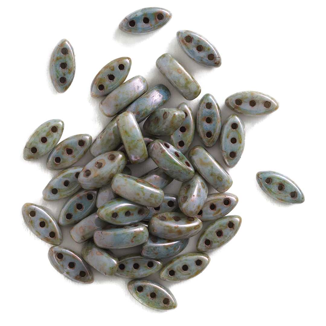 Open in modal - John Bead Czech Glass Cali Three-Hole Beads - White and Blue Luster beads in loose pile