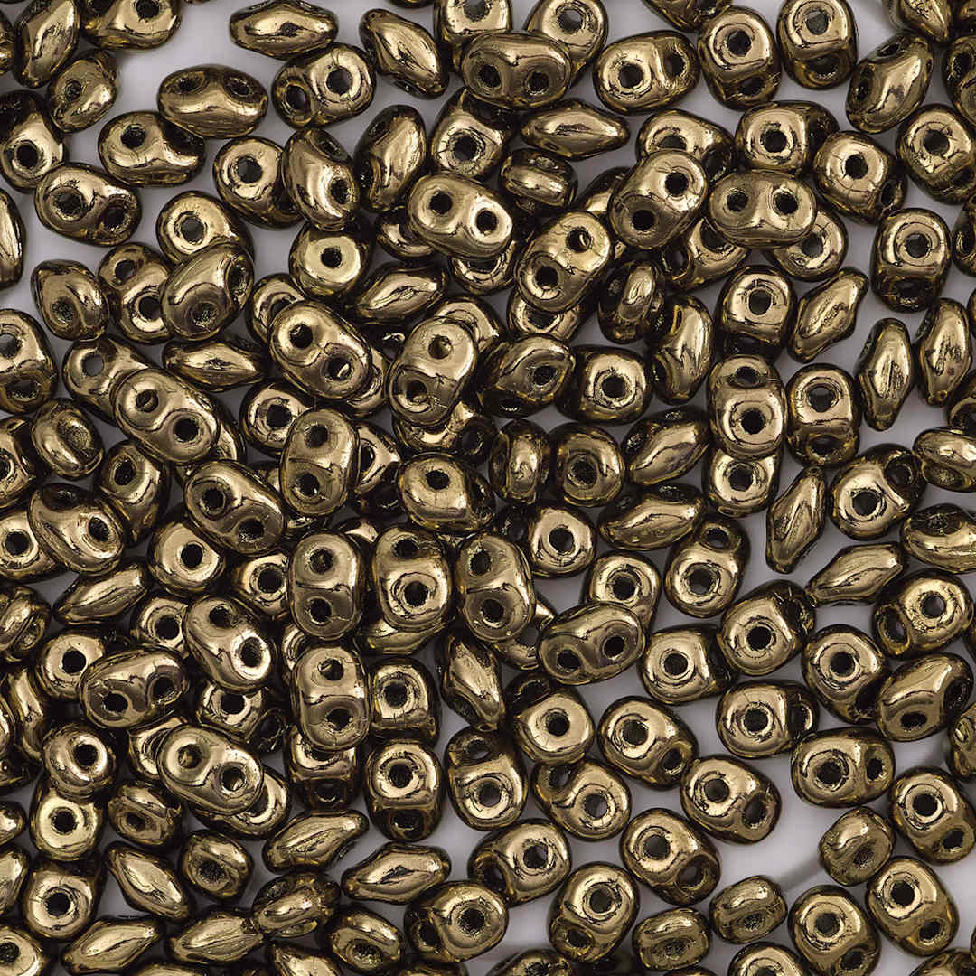 Open in modal - John Bead Czech Glass SuperDuo Two-Hole Beads - Pile of Bronze beads shown