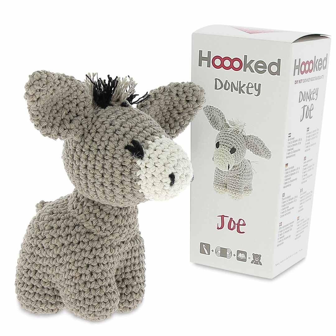 Open in modal - Hoooked DIY Animal Crochet Kits - Crocheted Donkey next to package
