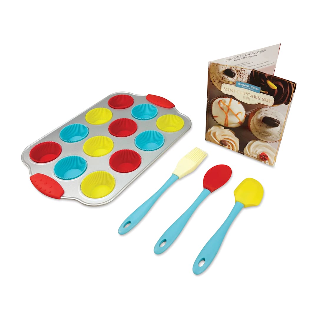Open in modal - Handstand Kitchen Mini Cupcake Set, contents shown in front of recipe book.